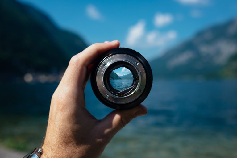 holding a lens