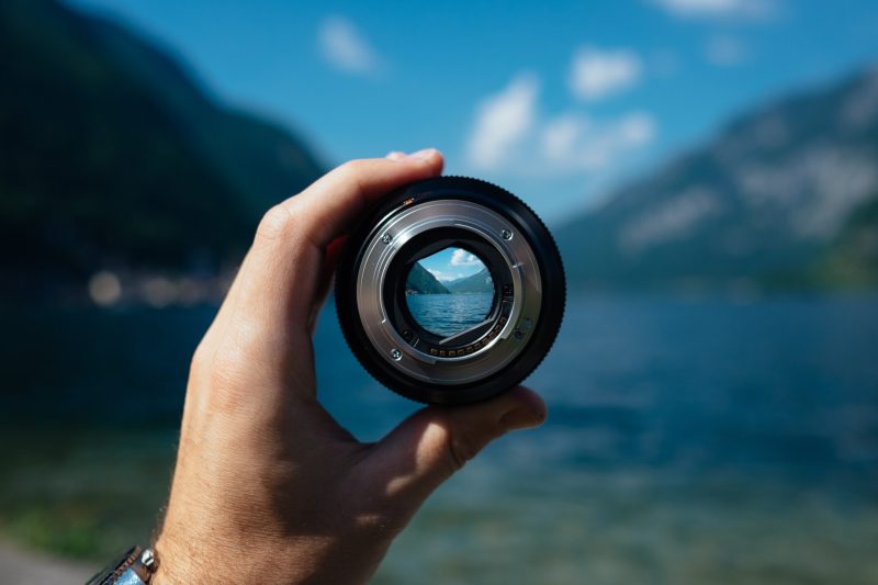 holding a lens